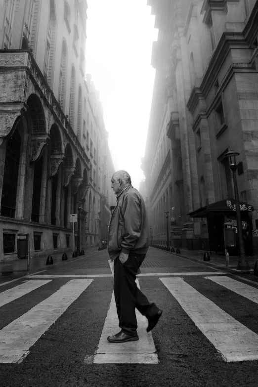 a man is walking down a street in a building