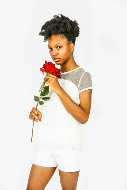 a woman with short hair and red flowers