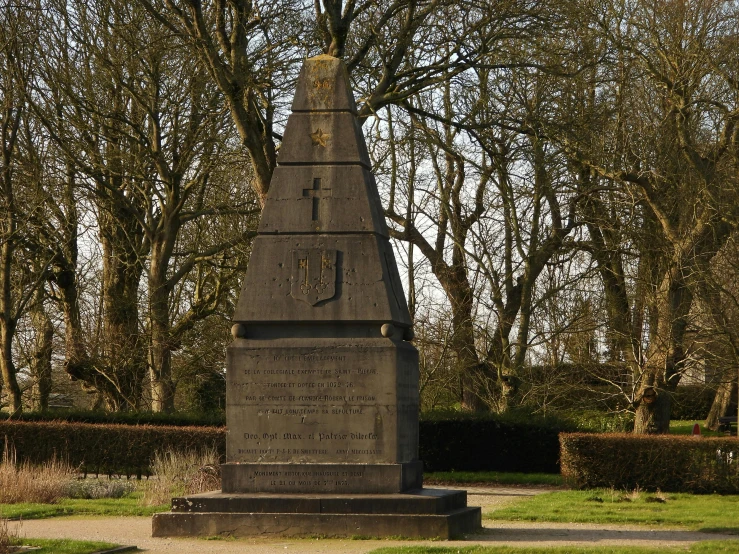 a obelisk with a clock on the top of it