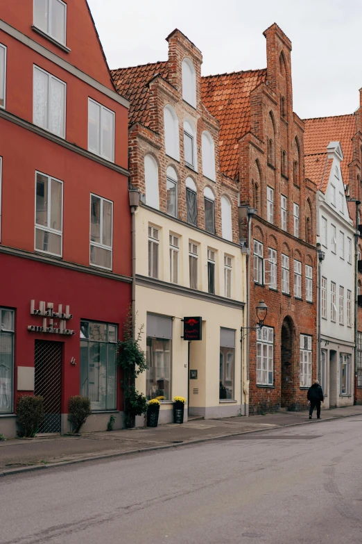 an old fashion row of houses along side a street