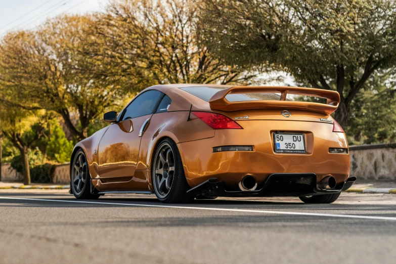 the rear end of a very pretty modified car