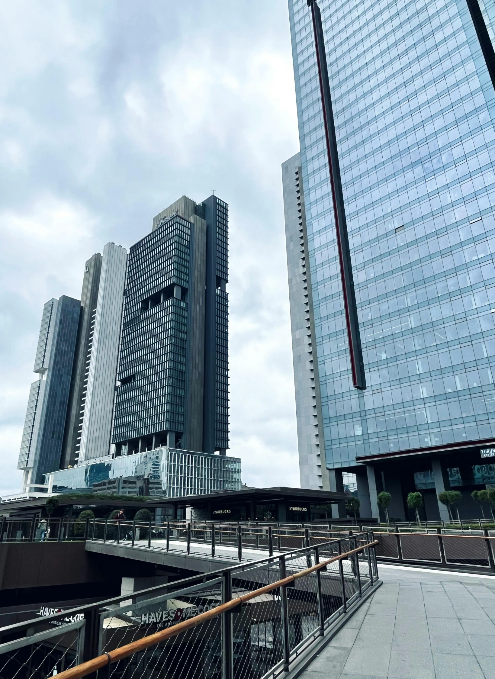 two buildings in a city on a cloudy day