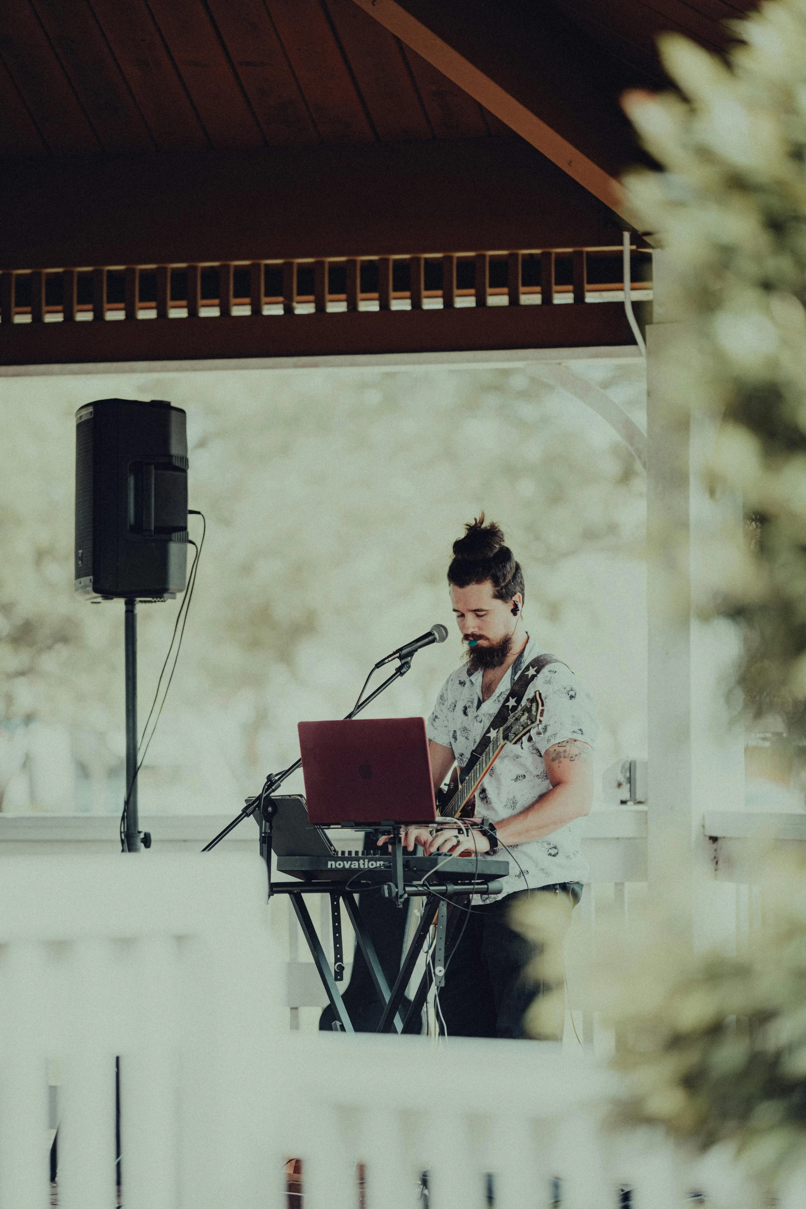 a man is playing the keyboard and computer