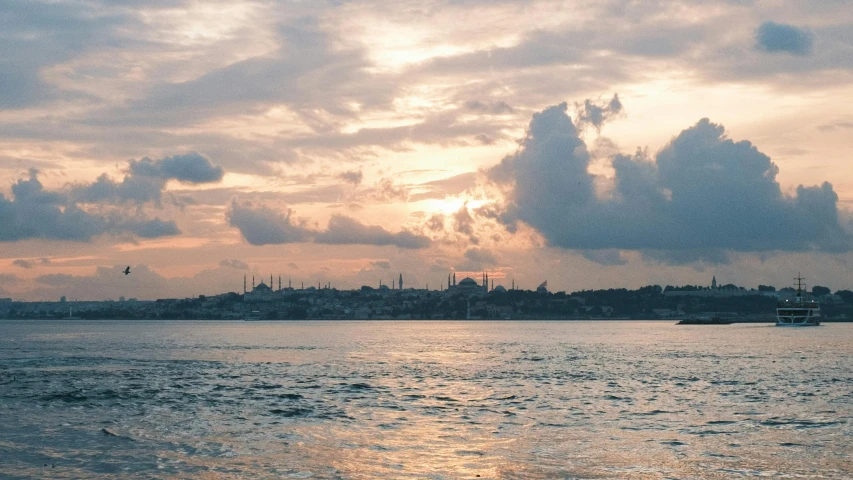 a boat is going under an overcast sky