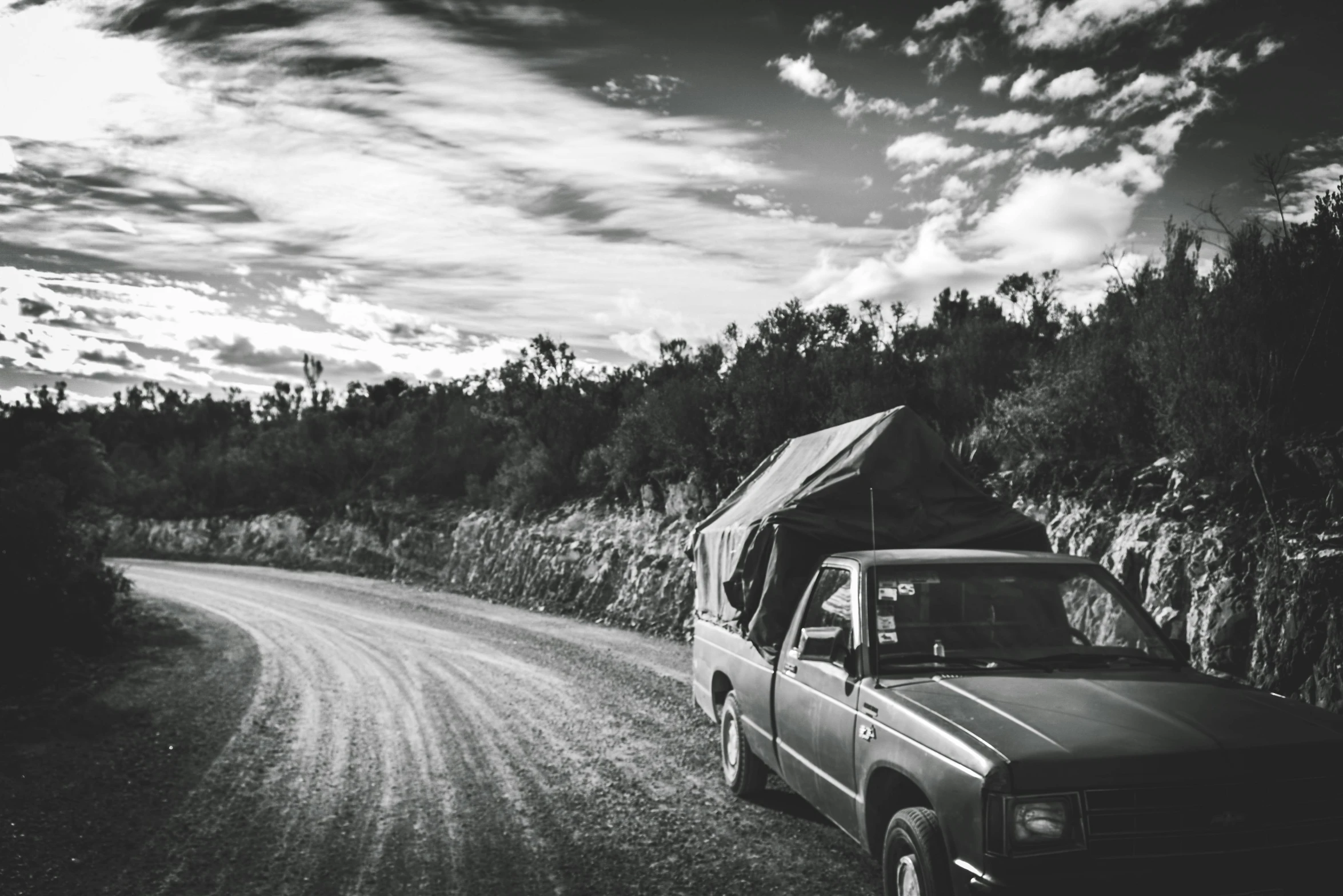 a black and white po of a truck towing a tent