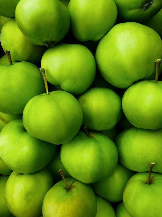 an image of a lot of green apples