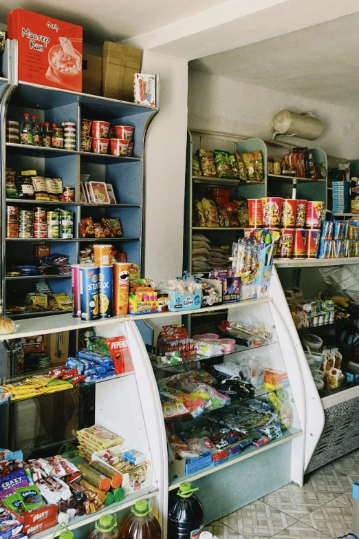 a retail shop with several shelves filled with food