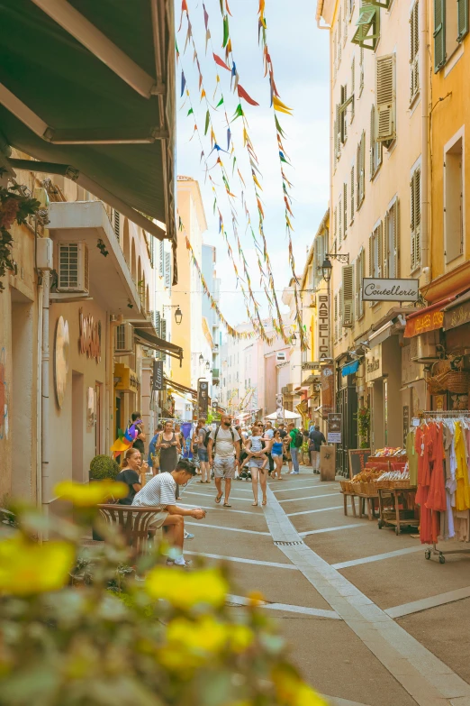 a crowded street in an old town during the day