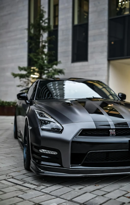 the front end of a black sports car