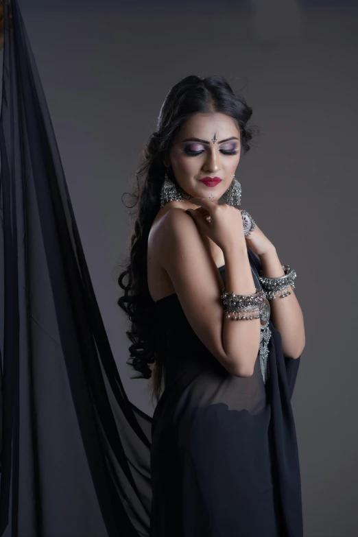 a woman posing with jewelry on her hands