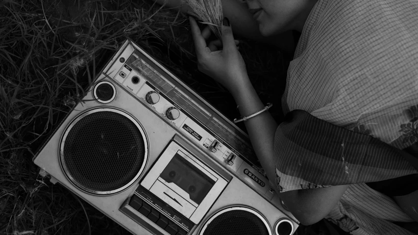 black and white po of woman with boom box
