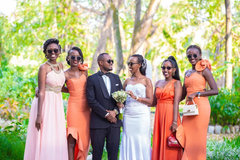 a bride and her family standing together outside