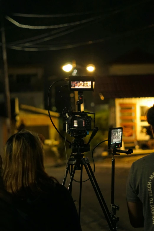 a person is standing in front of a camera