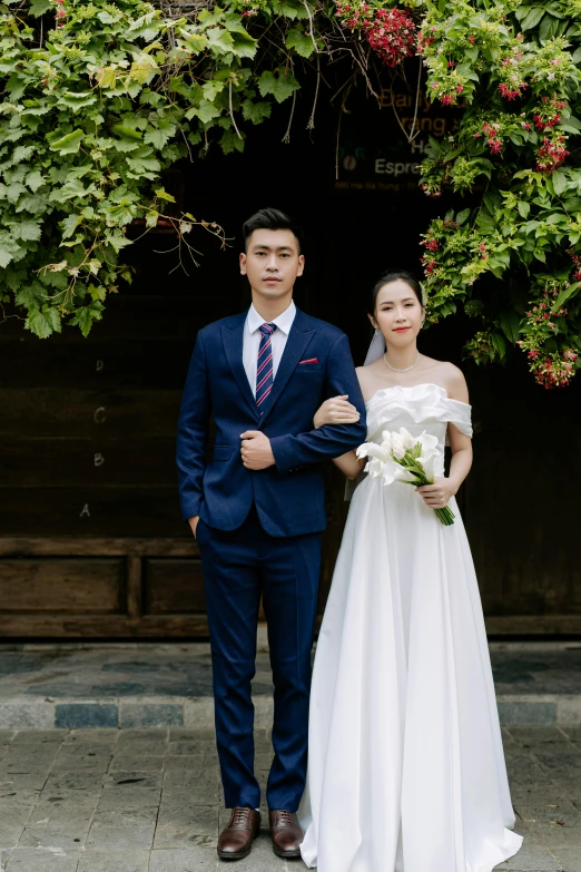 a bride and groom pose for a po together