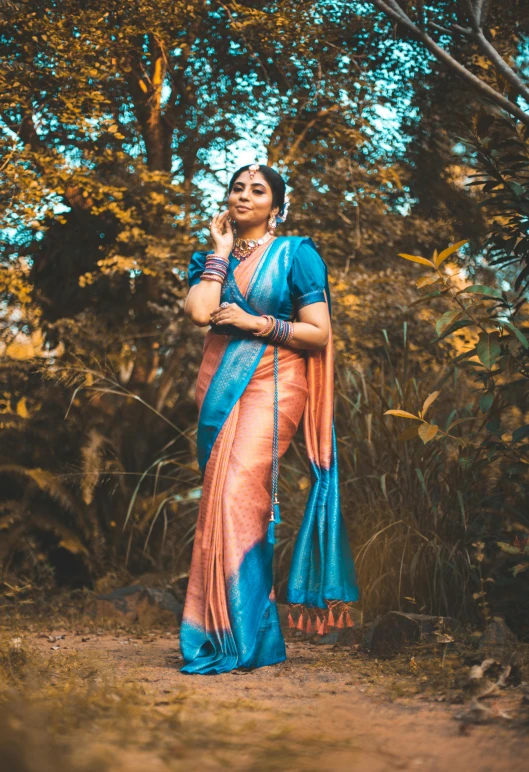 woman in traditional indian costume posing for po