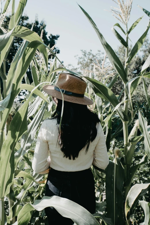 a woman standing on the side of a field