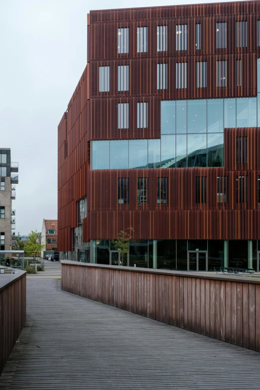 a very unusual building made of wooden slats