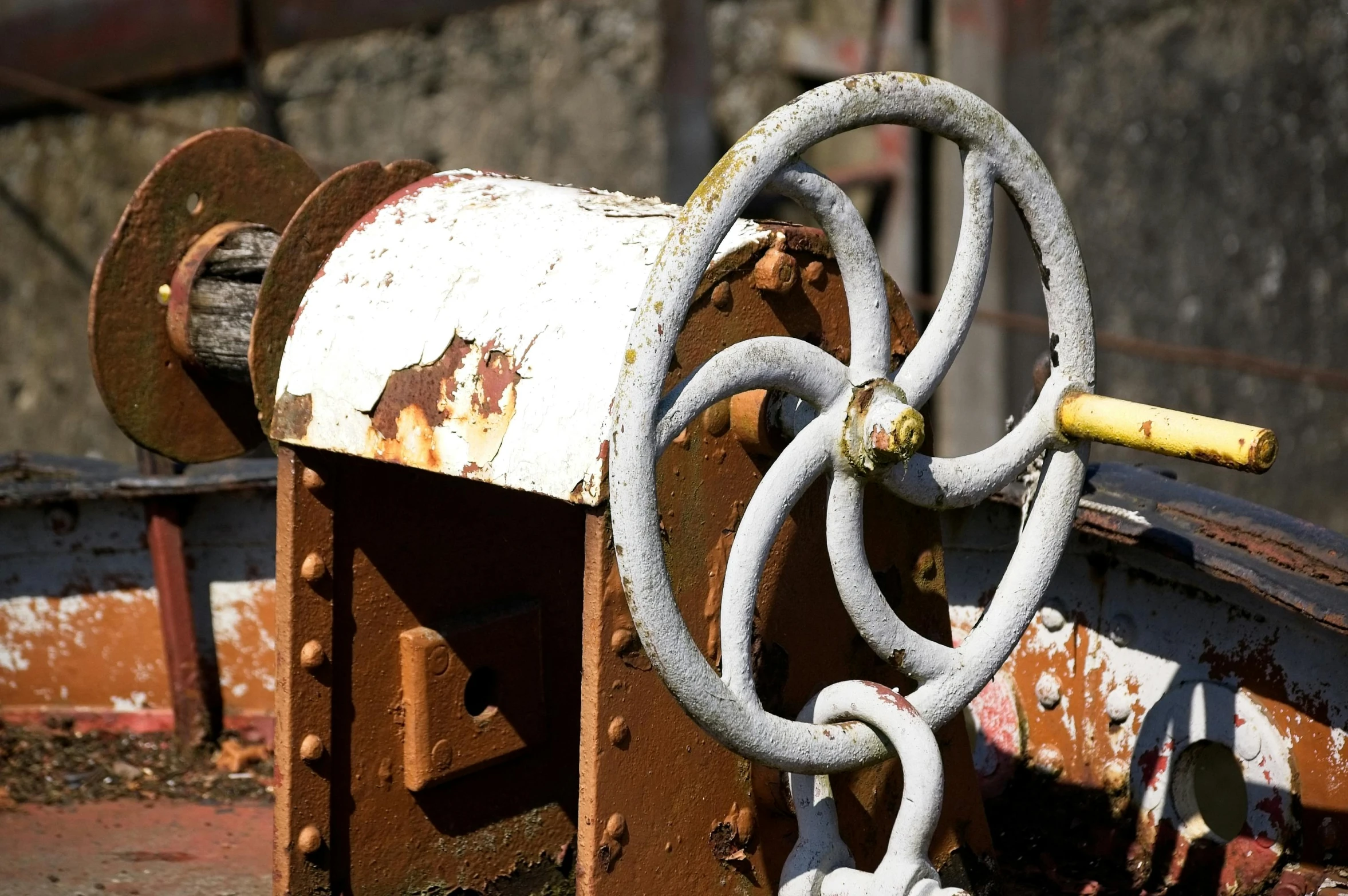 a rusty and rusted object with chains is shown