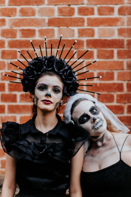 two women in makeup look like they are skeletons