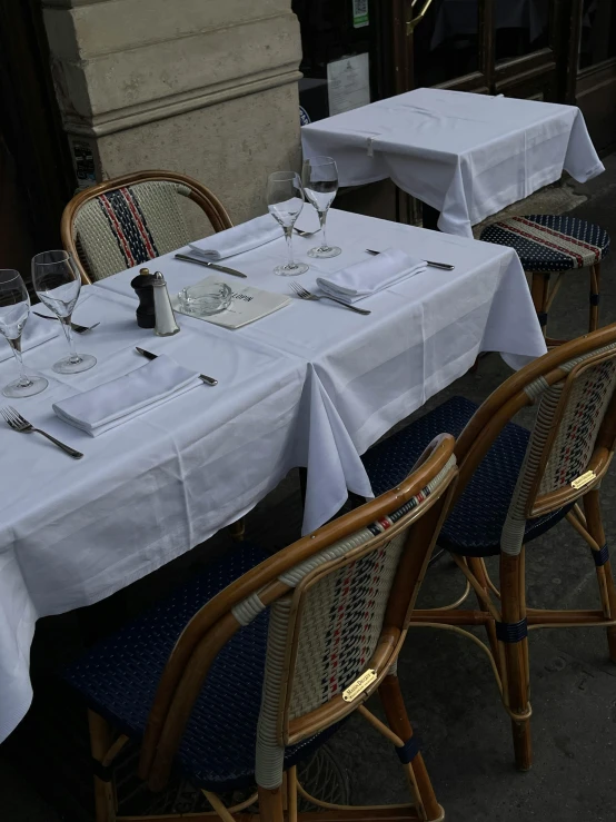 a group of table cloths are laid out on a dining table