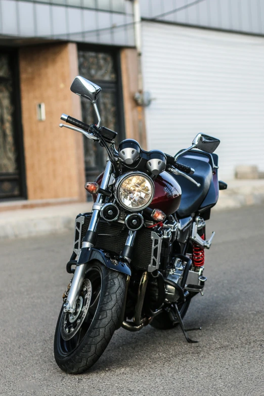 a black motorcycle parked on the side of the road