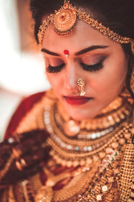 indian bridal woman in traditional makeup art