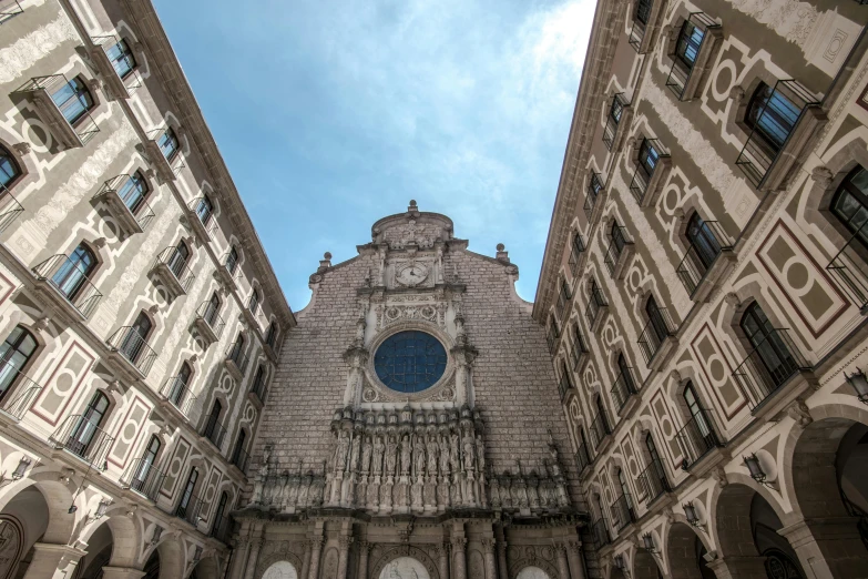 a tall clock tower sitting between two tall buildings