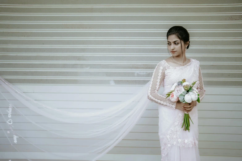 a bride with her veil blowing in the wind