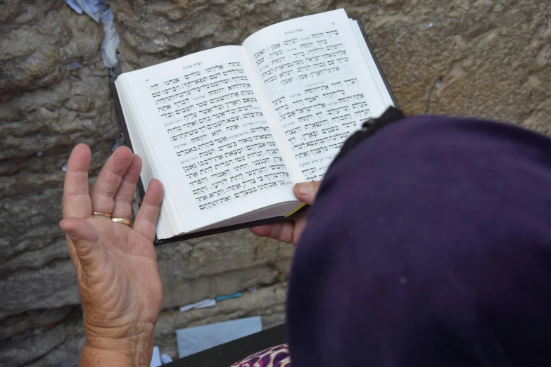 a person holding a book in their hand