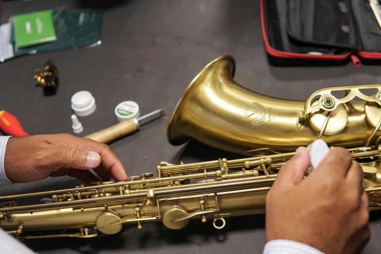 a person playing the saxophone on a table