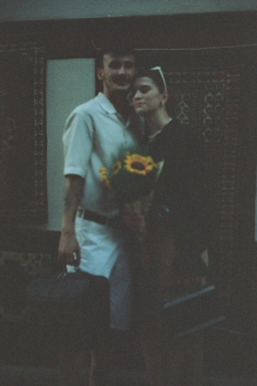 a man and a woman standing outside with luggage