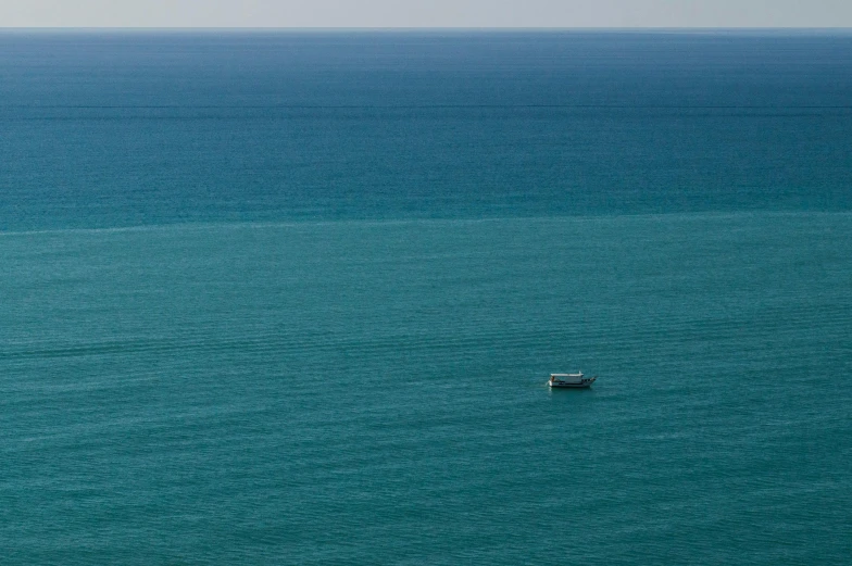 a boat that is floating in some water