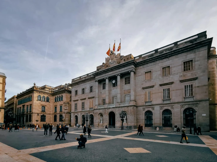 a view of an old building with a person walking by