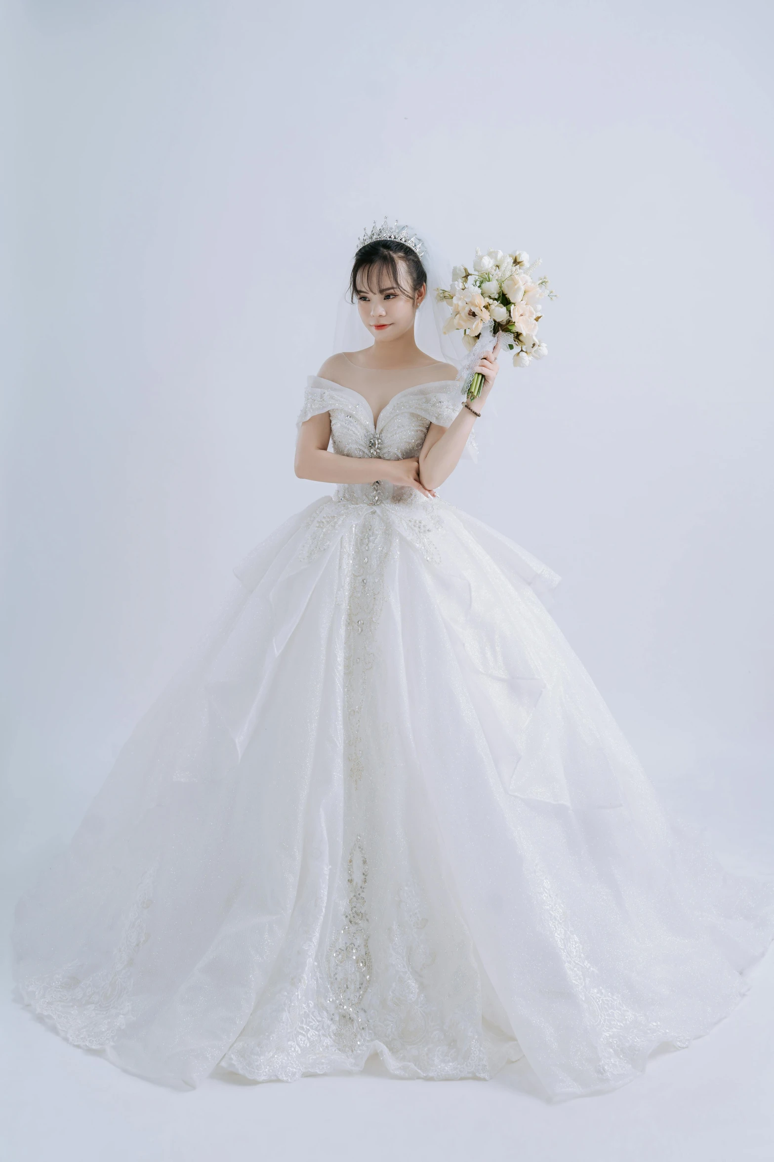 a woman in a wedding dress is posing