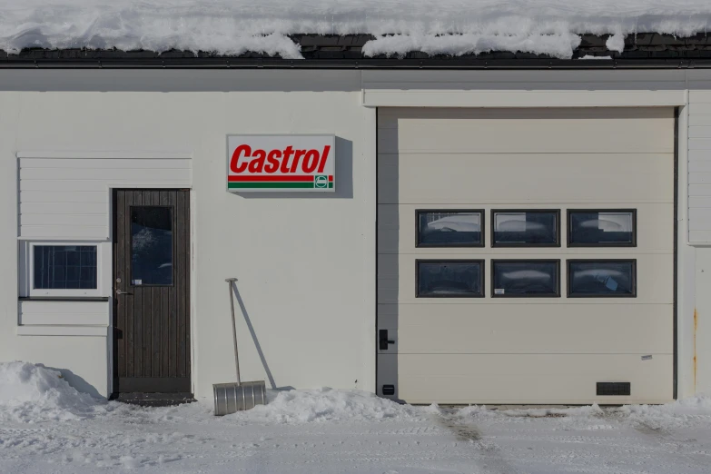 white wall covered in snow with a castro sign