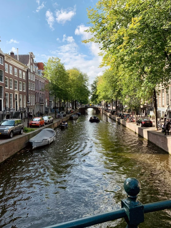 a river running through a city on either side of a street