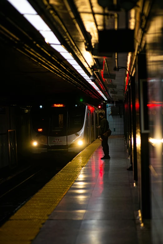 the light on the subway platform casts a shadow