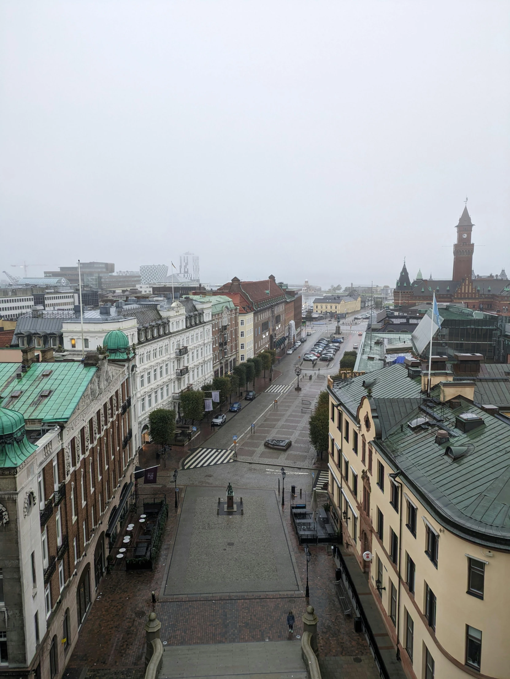 the view of a busy city area with high rises in the distance