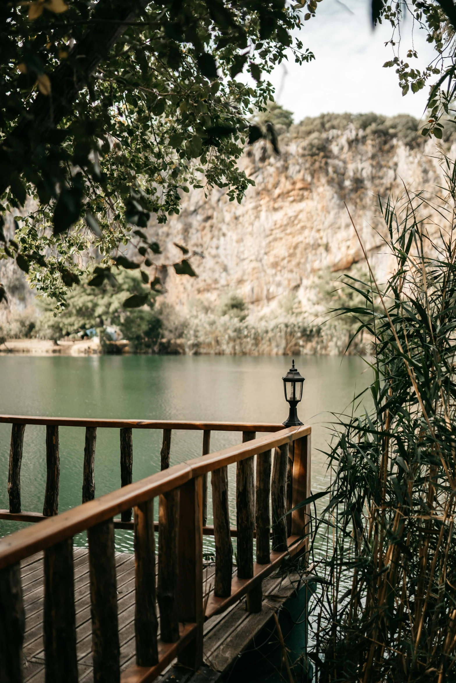 a wooden deck overlooks a large body of water