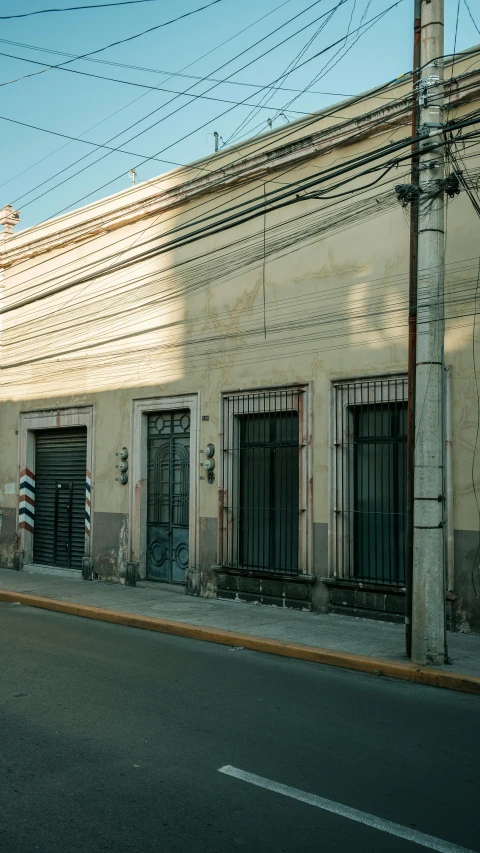 the front facade of a building with some doors