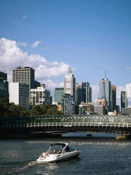 the water taxis down the river in the city