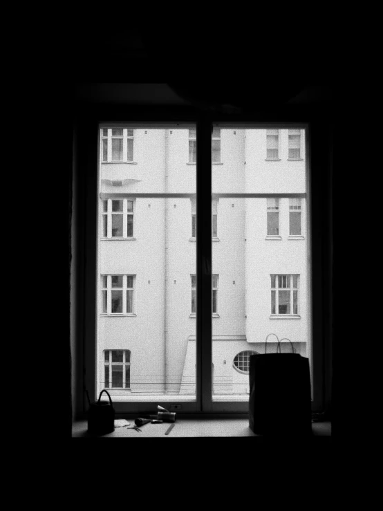 looking out of a window with multiple windows and a couch near by