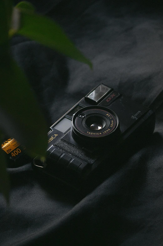 a camera sitting on top of a black surface