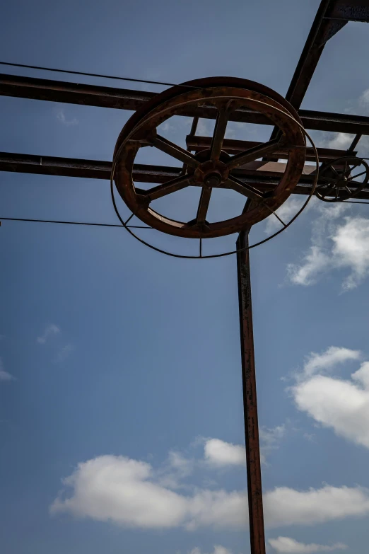 an artistic sculpture made out of wires under blue sky