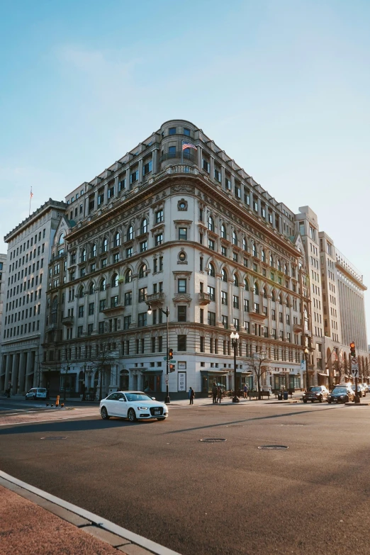 an old building sits on the corner of a street