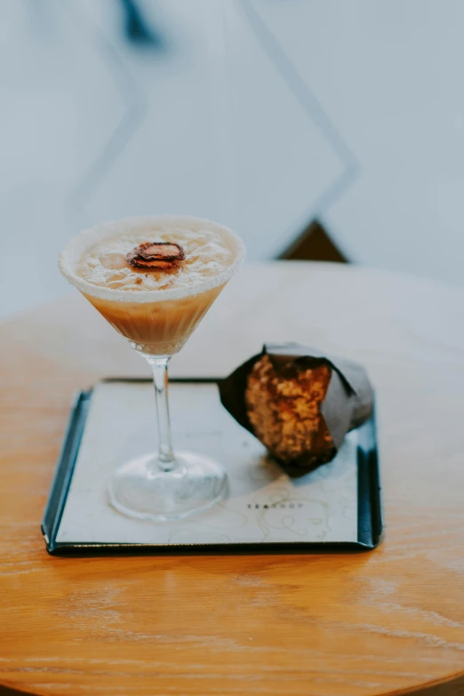 a close up of a drink in a glass on a table