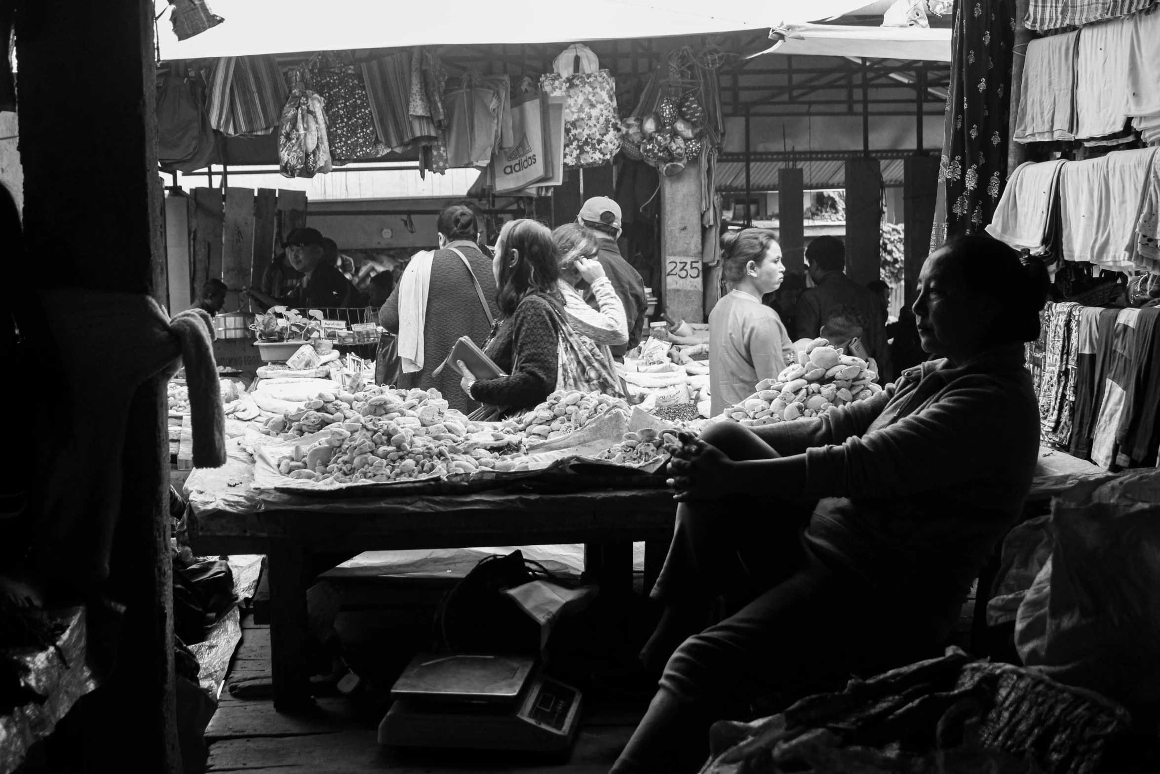 several people in an open market place on their own