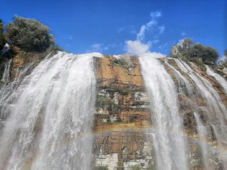 waterfalls cascading down onto the ground