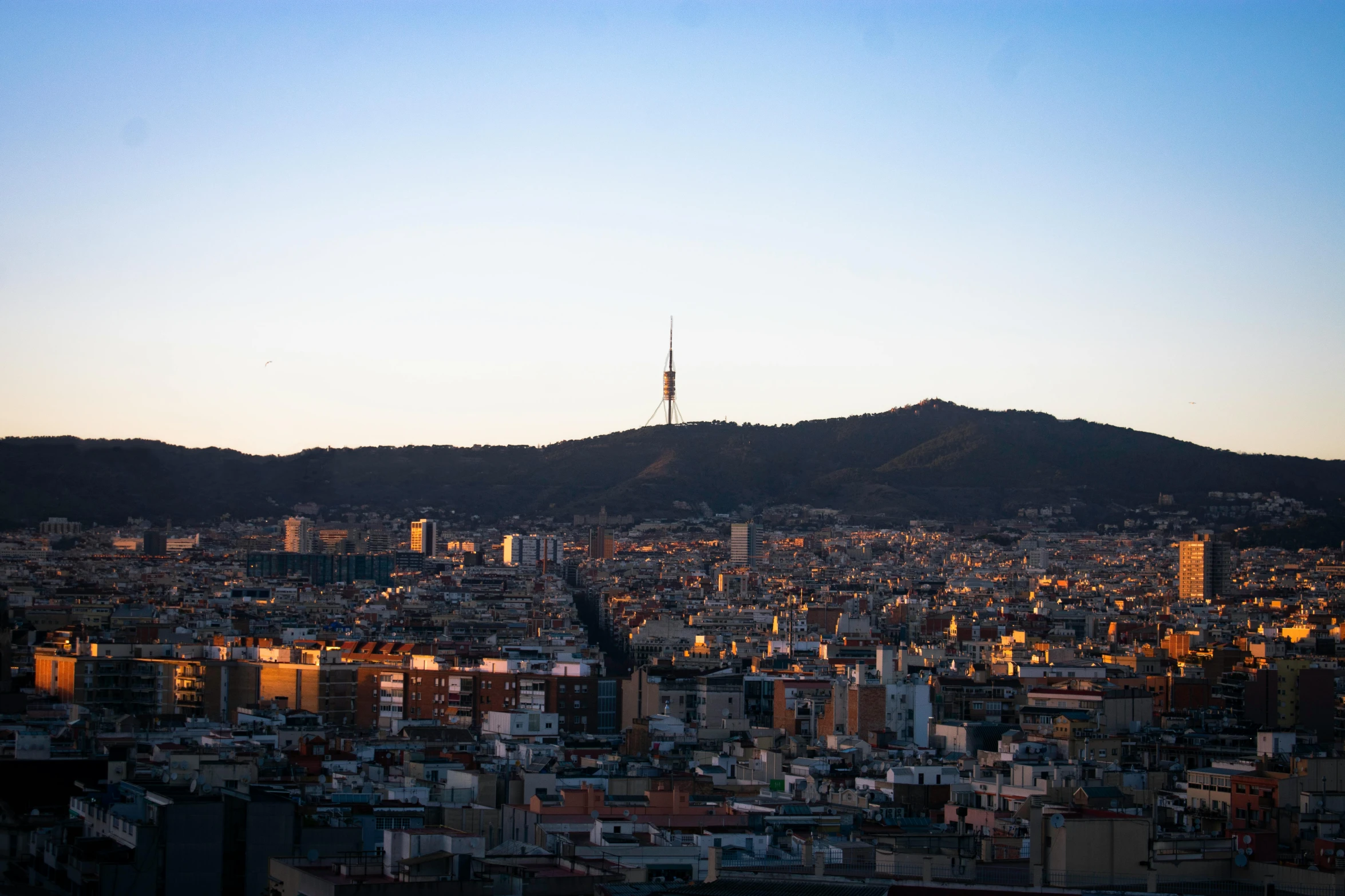 a distant view of a city at sunset