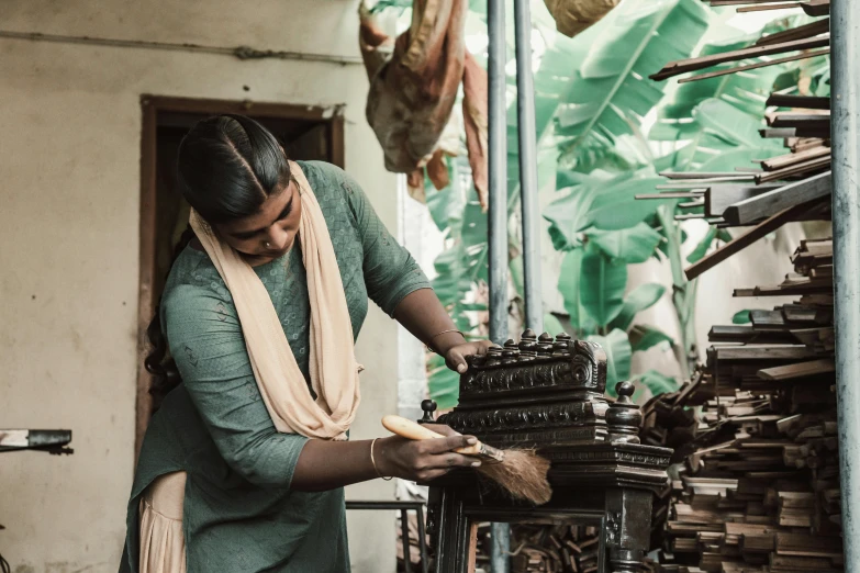 woman working on an old type of typewriter